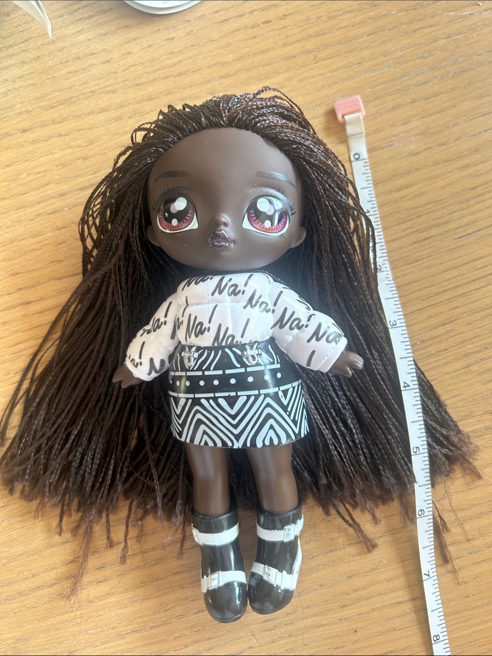 Gorgeous Vinyl Fashion Doll with Patterned Skirt and Brown Braided Hair